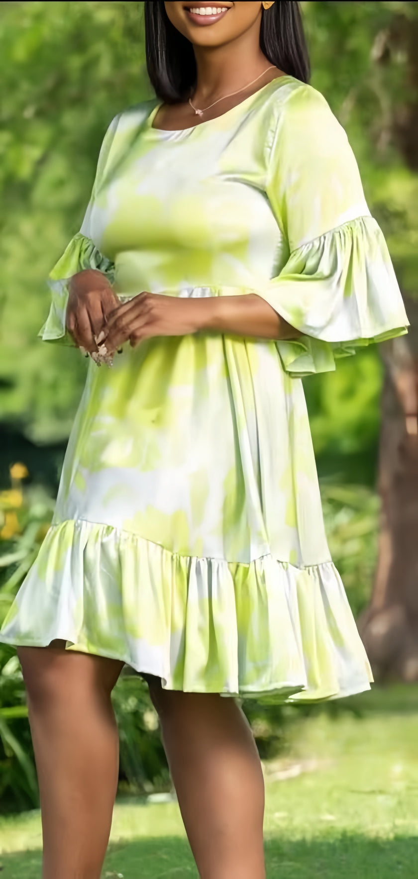 Light green ruffle mini dress with tiered skirt and flared 3/4 sleeves