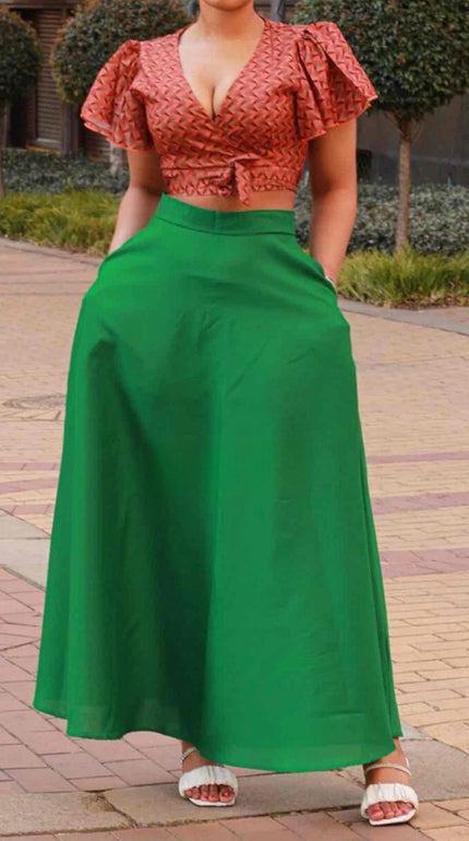 Two-piece geometric ruffle top and green flared maxi skirt, knotted waist