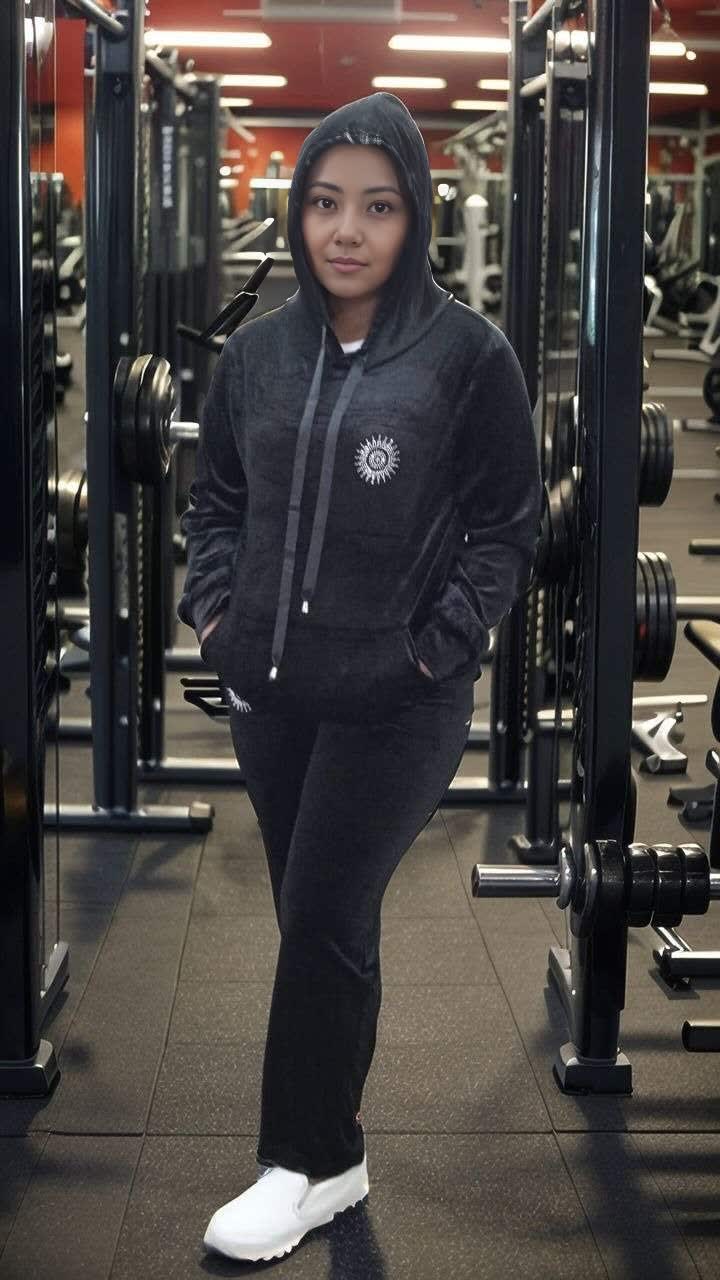 Dark hooded zip tracksuit set with drawstring and round chest emblem; matching pants
