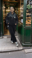 Black hooded zip tracksuit set with round logo on chest and matching pants