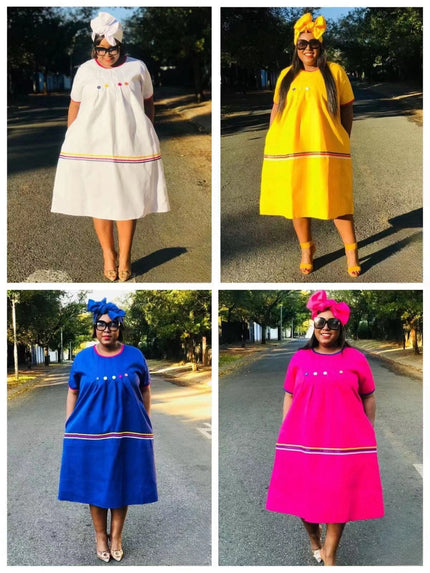 Buttoned bodice dresses in white, yellow, blue, and pink with striped hem trim