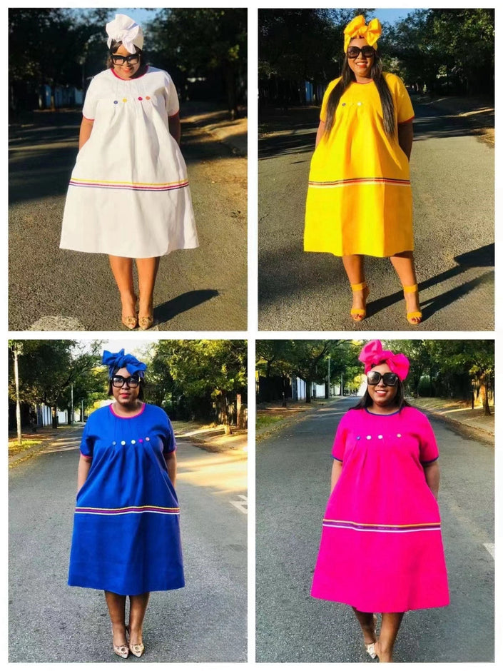Buttoned bodice dresses in white, yellow, blue, and pink with striped hem trim