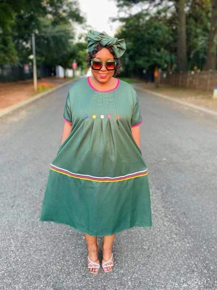 Green button-front dress with short sleeves, gathered skirt and colorful hem trim