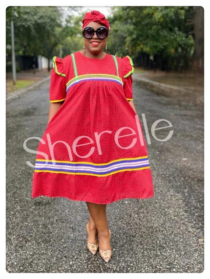 Red midi dress with matching headwrap, short sleeves, and striped hem trim