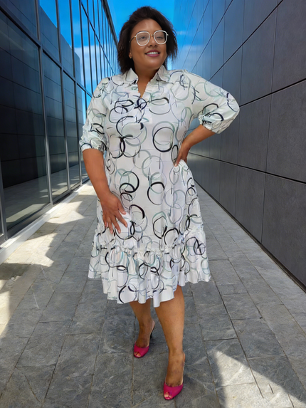 Plus size ruffle-hem midi dress with geometric circle print, button-front, short sleeves