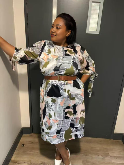 Abstract print midi dress with stretch waist, white base with black and olive shapes