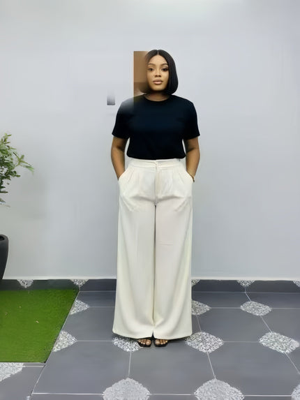 High-waist wide-leg pants in white with belt loops and front button closure