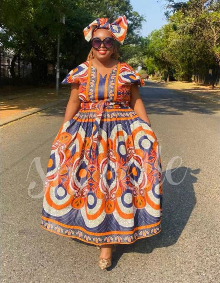 African print maxi dress with headwrap, orange and blue patterned tiered skirt