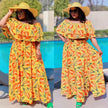 Off-shoulder yellow floral maxi dress with ruffled neckline and tie waist belt.