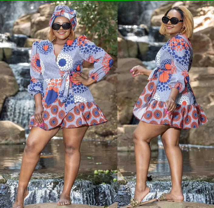 Belted mini dress with puff sleeves, blue and orange geometric print, short flared skirt.