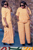Geometric twin set: yellow patterned 3/4-sleeve top and wide-leg pants
