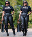 Black faux leather pants with stretch waist and cuffed ankles, jogger style