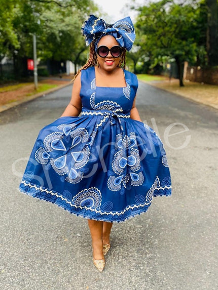 Blue printed A-line skirt dress, sleeveless square neck with bow and floral embroidery
