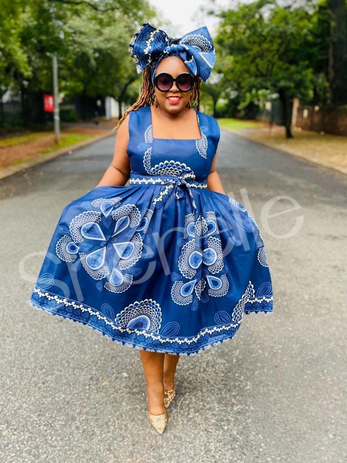 Blue printed A-line skirt dress, sleeveless square neck with bow and floral embroidery