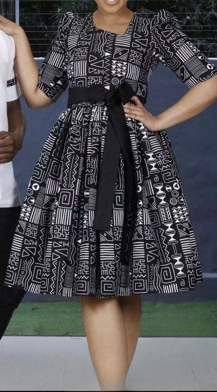 Belted geometric midi dress with puff sleeves, black-and-white print, wide skirt