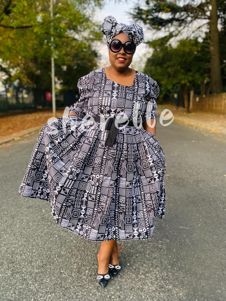 Geometric Print Flared Midi Dress with Belt Detail