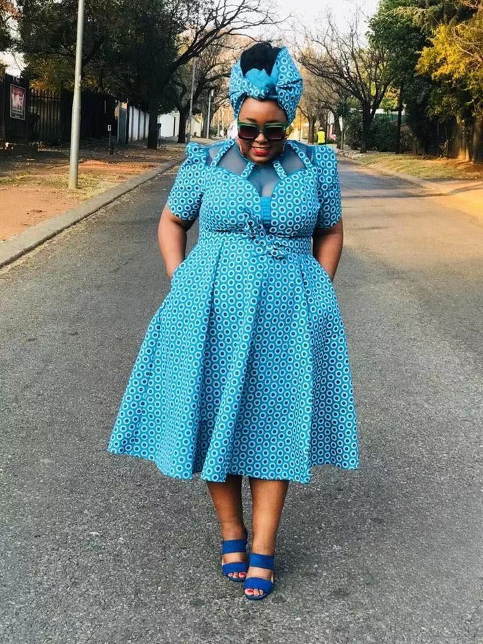 Turquoise patterned midi dress set with tie waist, bow headwrap, and short sleeves