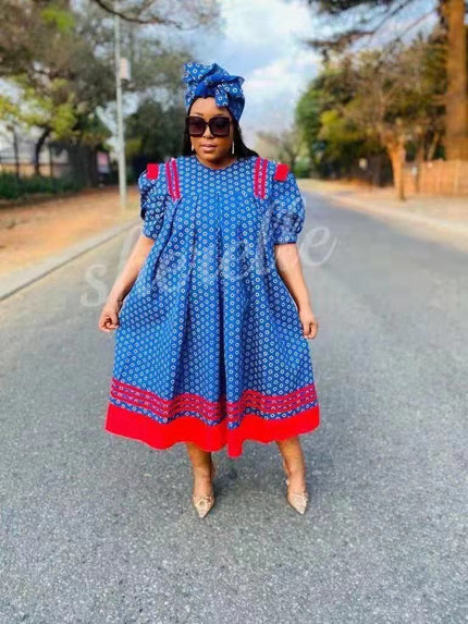 Blue puff-sleeve midi dress with small print and red hem trim
