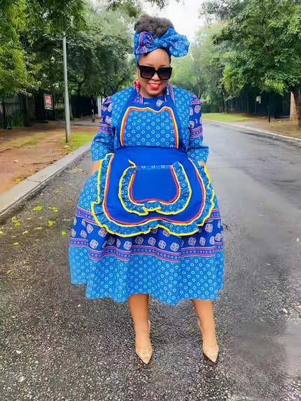 Layered African print dress in bright blue with multicolor trim and apron-style front
