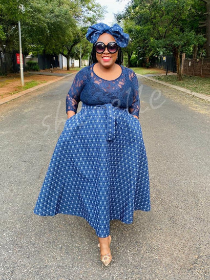 Geometric lace midi dress in navy-blue with 3/4 sleeves and flared skirt