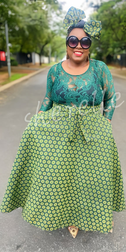 Geometric lace midi dress in green with 3/4 sleeves and flared skirt