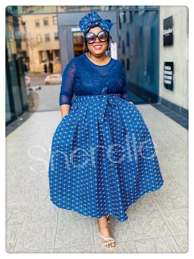 Traditional Geometric-Patterned Dress with Lace Bodice and Three-Quarter Sleeves