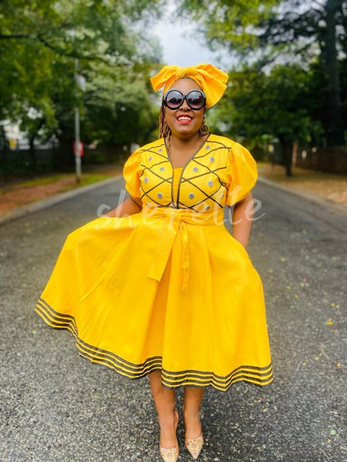 Yellow puff sleeve A-line midi dress with embroidered bodice and striped hem