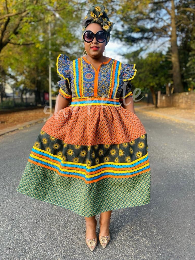 African print puff sleeve midi dress, orange top and green skirt with striped trim