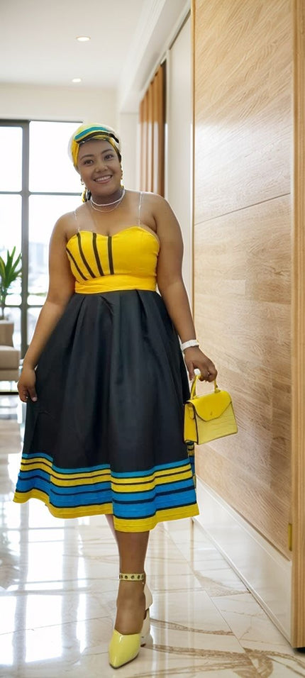 A-line midi dress, yellow strapless bodice and black skirt with blue-yellow stripe hem