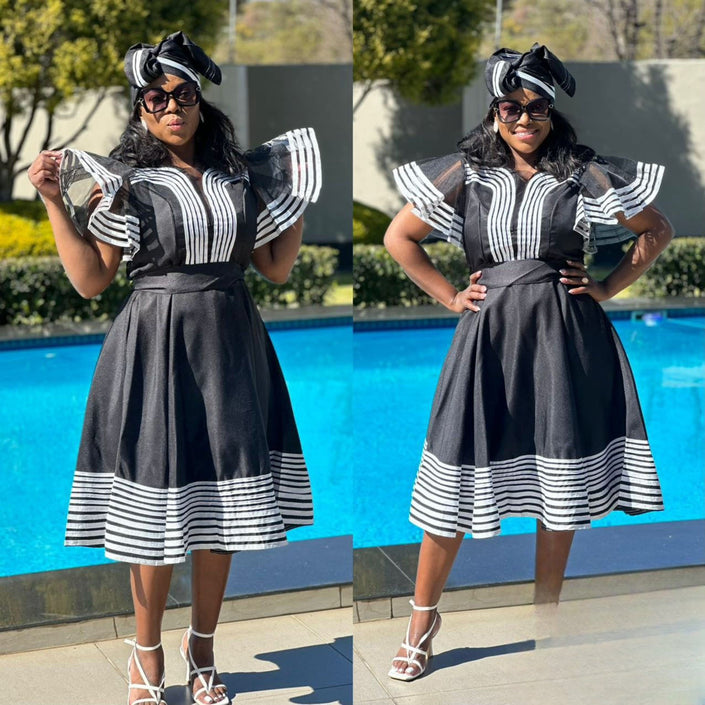 Black striped midi dress with ruffle hem and puff sleeves