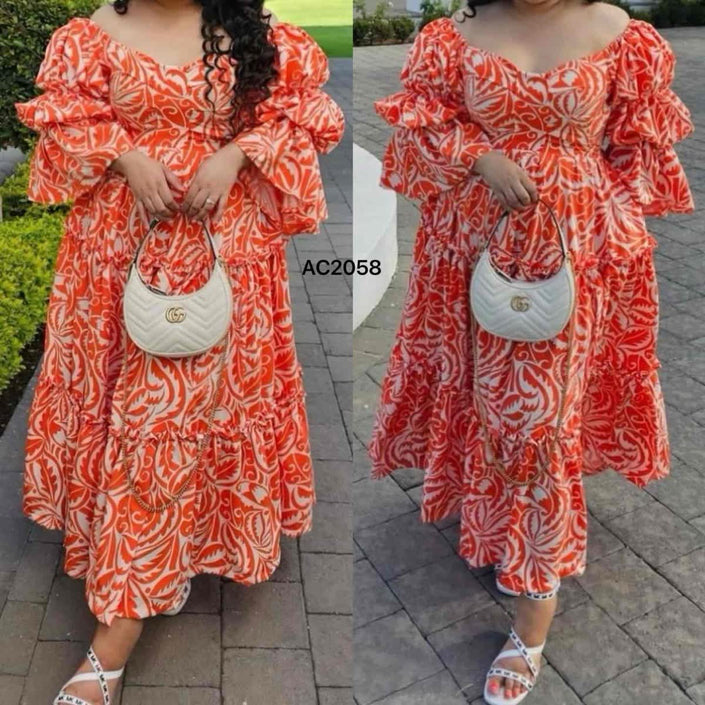 Orange-red printed maxi dress with tiered ruffles and long flounce sleeves