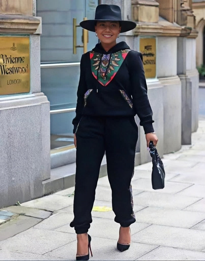 Black twin set with African print V-neck panel and matching jogger pants, long sleeves.