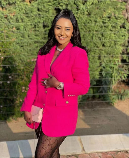 Women’s hot pink double-breasted blazer with notched lapels, long sleeves, gold buttons