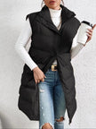 Black puffer vest with high collar, quilted padding, snap-button front