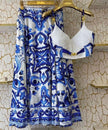 Printed skirt and ruched top on hangers, blue-and-white ornate pattern with white bodice