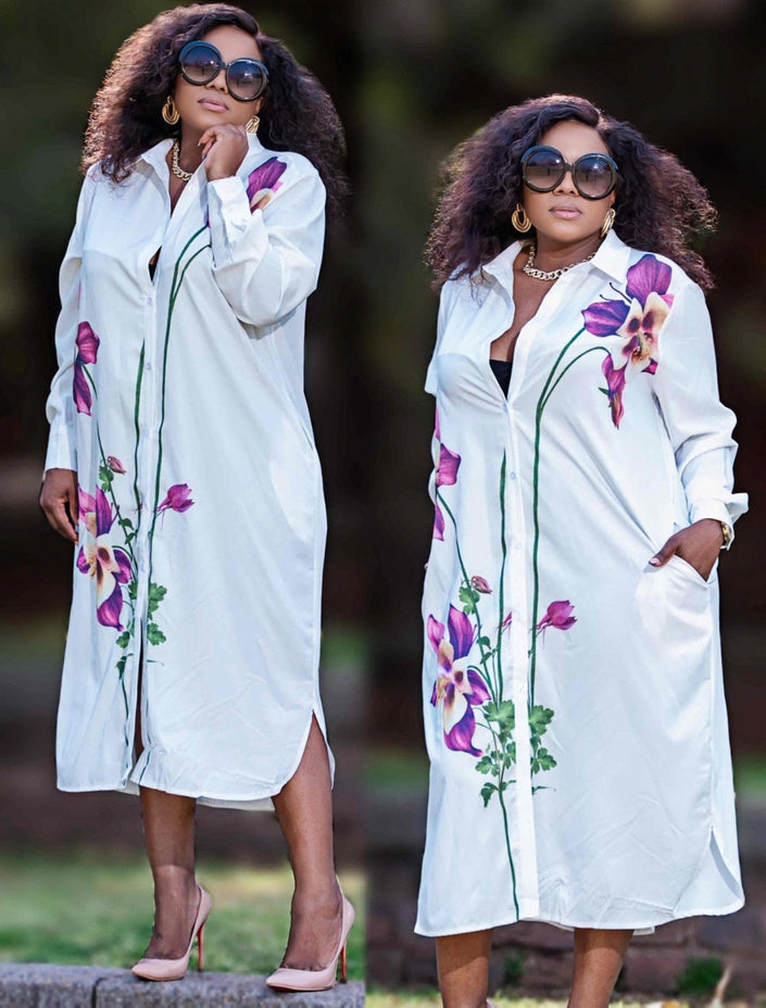Plus size white floral button-front shirt dress with long sleeves and side slit