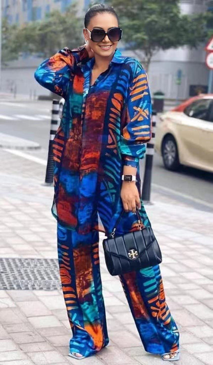 Abstract printed twin set with long-sleeve button top and wide-leg pants, blue and orange.
