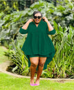 Deep green high-low tunic set with button placket, long sleeves, asymmetrical hem