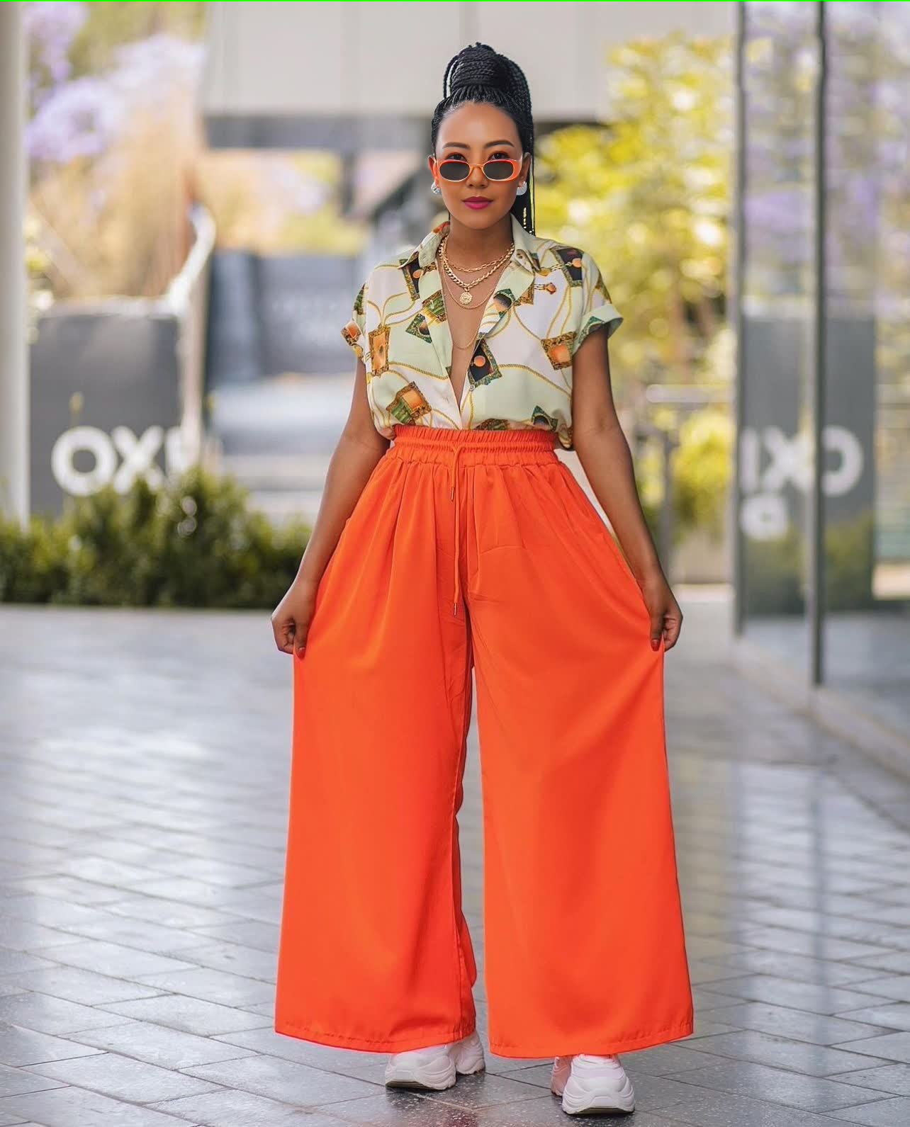 Tropical print twin set with short-sleeve shirt and orange wide-leg pants