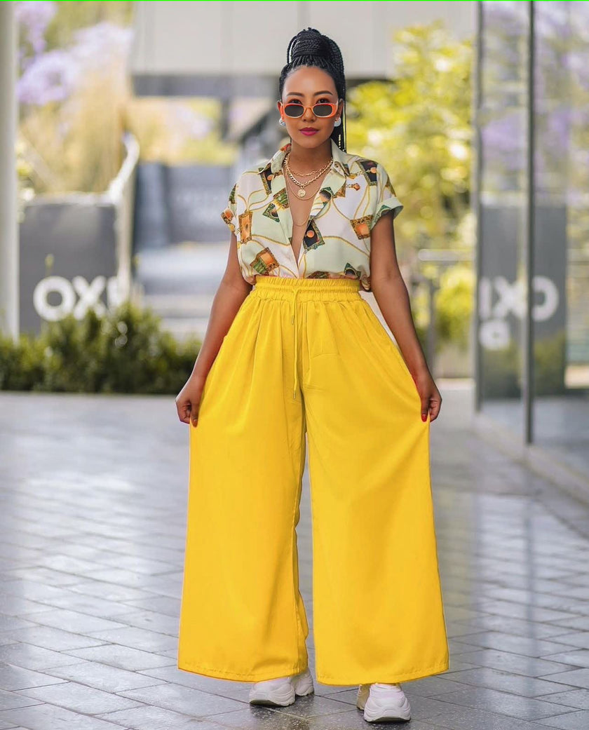 Tropical print twin set with short-sleeve shirt and yellow wide-leg pants