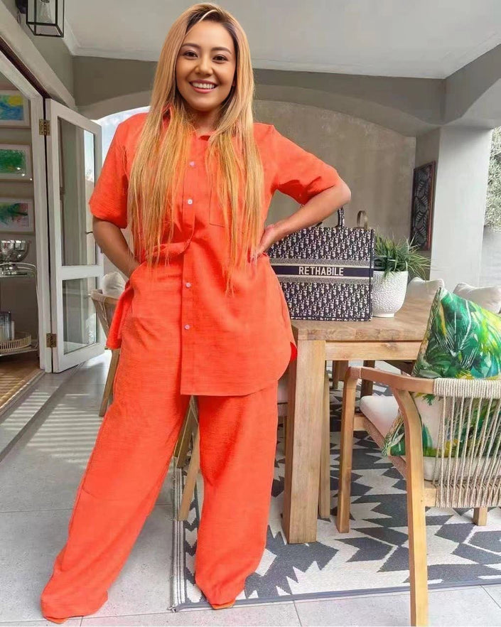 Orange-red short-sleeve collared button-front tunic set with matching wide-leg pants