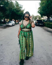 Green printed sleeveless V-neck pantsuit with waist tie and wide-leg trousers