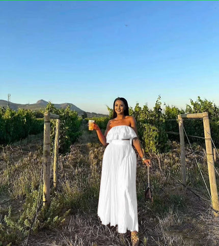 White off-shoulder maxi dress with ruffle neckline and tiered, gathered skirt