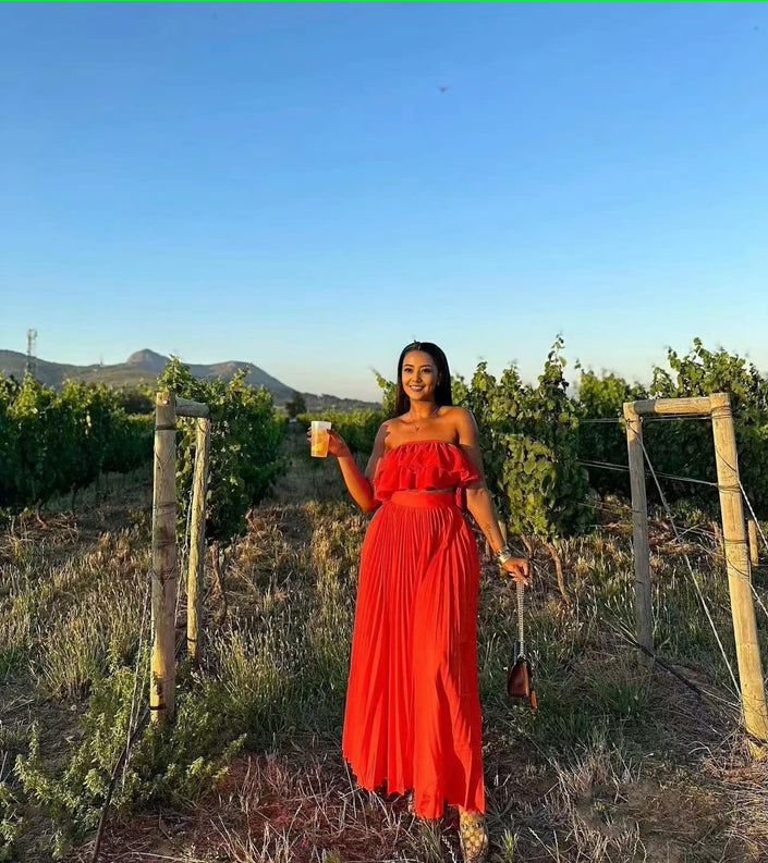Red off-shoulder maxi dress with ruffle neckline and tiered skirt