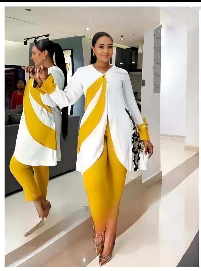 White asym hem top with draped panel and fitted yellow trousers