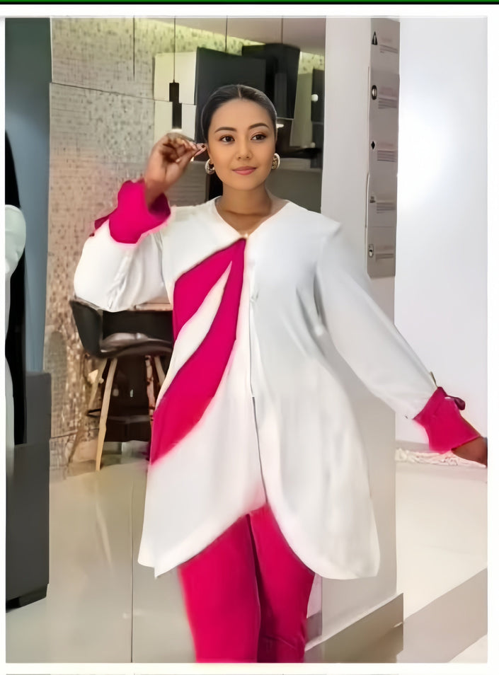 White asym hem top with draped fuchsia panel and fitted fuchsia trousers