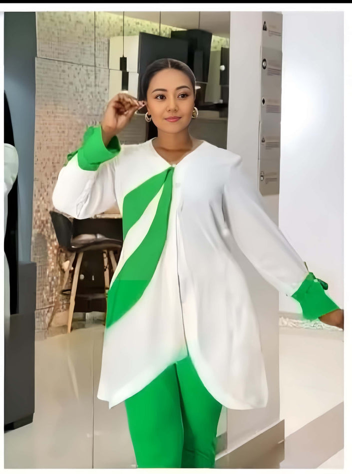 White asym hem top with draped green panel and fitted green trousers
