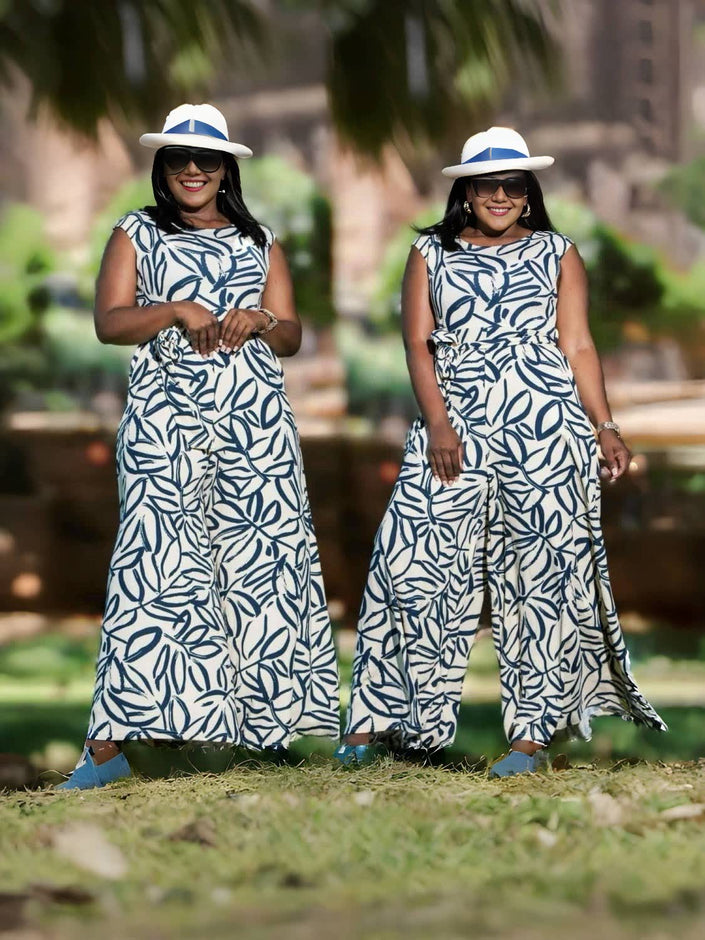 Leaf-print sleeveless loose-fit jumpsuit with wide legs, blue leaves on white