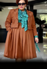 Brown plus size pleated skirt suit set with cropped blazer and matching pleated skirt