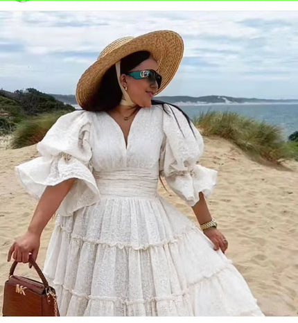 White tiered midi dress with puff sleeves and V-neck